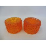 A pair of Whitefriars baxter bark orange glass candlesticks, 2 1/4" high.