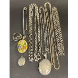 A selection of silver including three lockets, three necklaces, a ring and a kilt pin, approx.