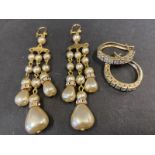 Two pairs of decorative costume earrings.