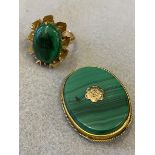 An unusual 1970s yellow metal ring set with a large oval piece of malachite plus an oval malachite