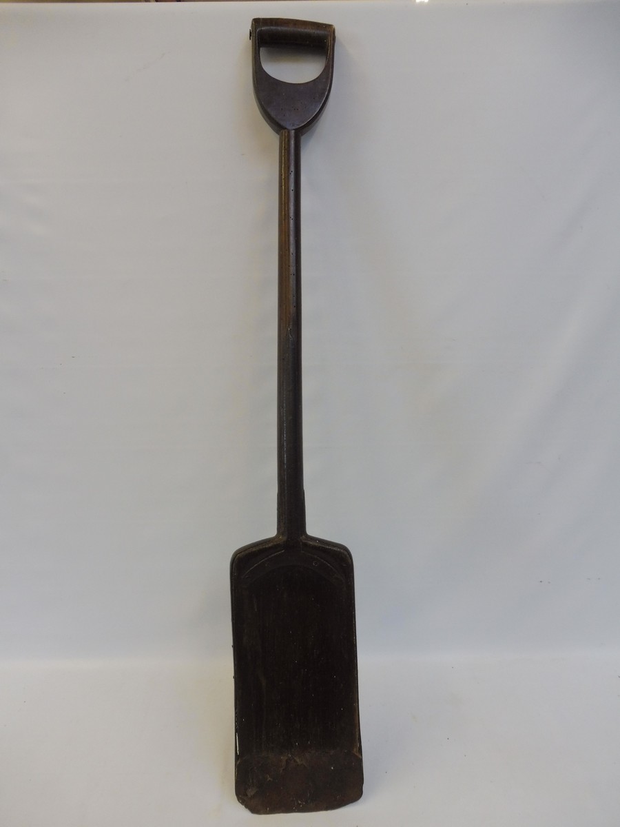 A 19th Century beech peat shovel with old iron repairs, 43 3/4" long.