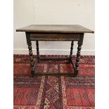 An 18th Century oak single drawer side table with all round stretcher.