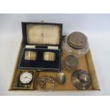 A tray of silver to include a cased pair of napkin rings, bracelets, an inkwell etc.