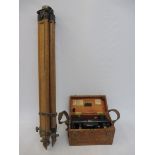 A cased Hall Bros theodolite on folding stand.