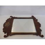 A George III mahogany pier mirror with gilded decoration.