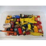 A box of vintage Tonka toys, various conditions.