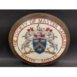 A Society of Master Saddlers oval plaque with central coat of arms, 14 1/4 x 12 3/4".