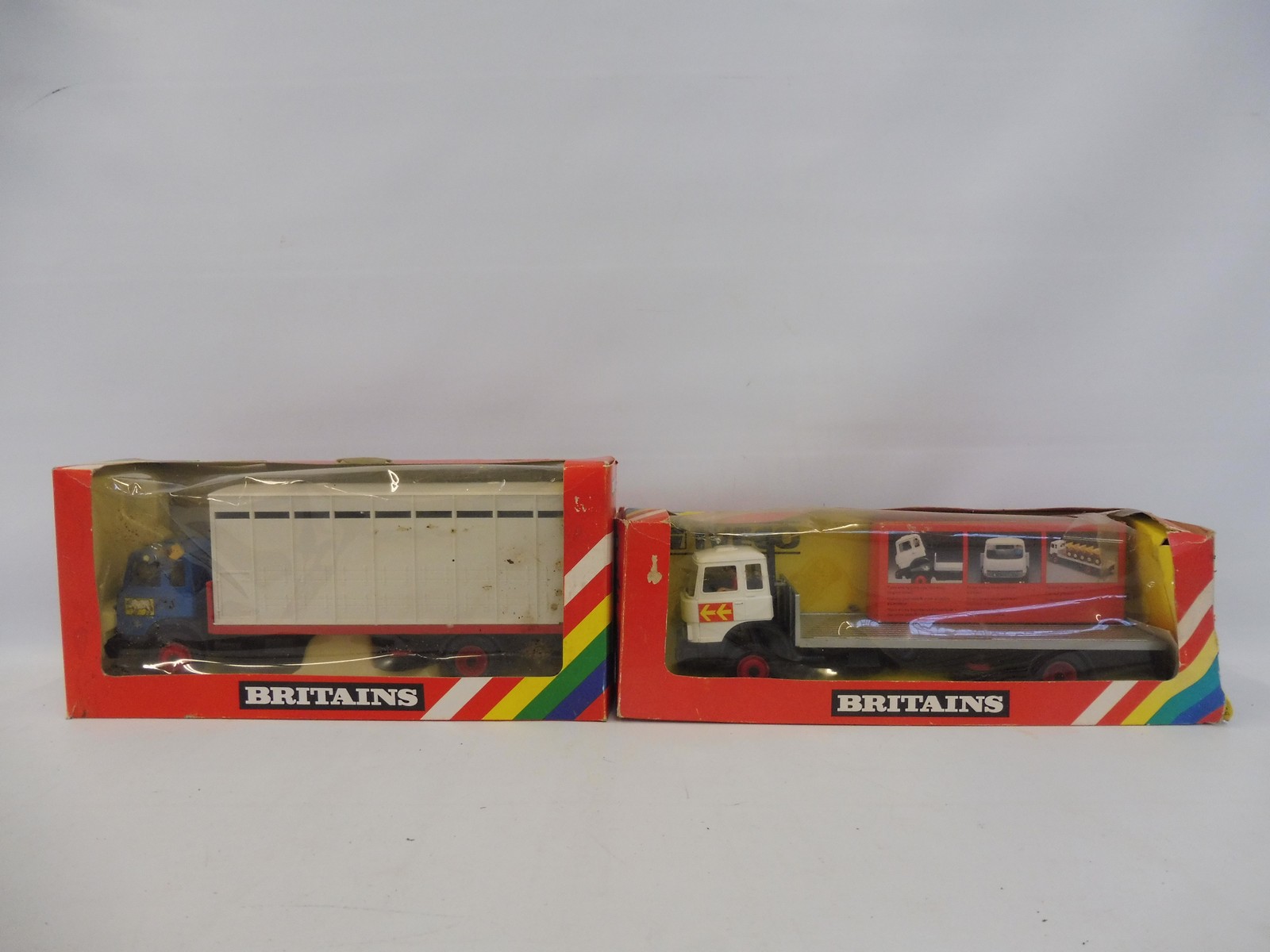 Two boxed Britains - no. 9580 and animal transporter and a 9582 flatbed transporter with inner