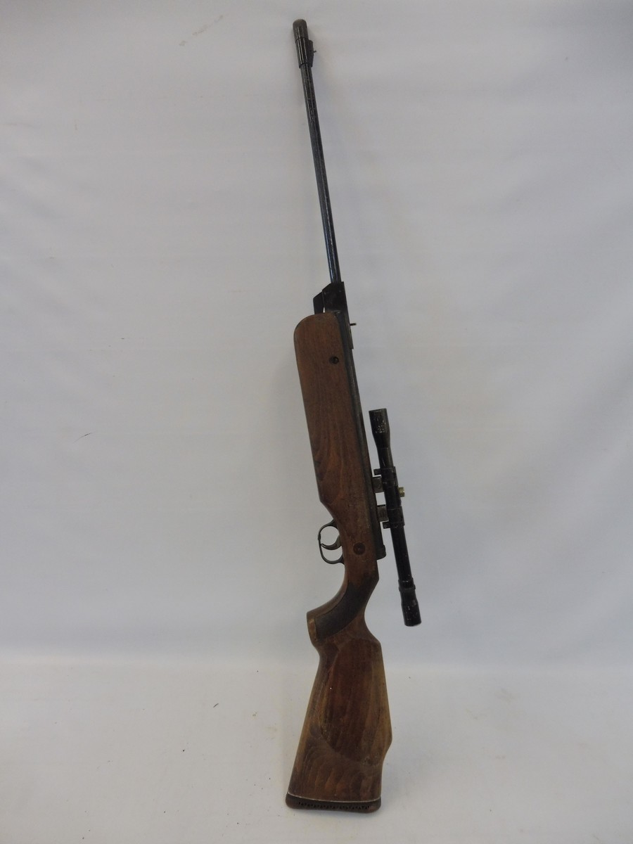 An unusual rifle with sight from a fairground shooting gallery, nice woodwork to the stock.