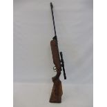 An unusual rifle with sight from a fairground shooting gallery, nice woodwork to the stock.