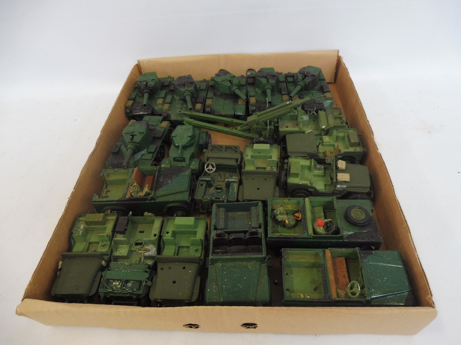 A box of assorted military diecast to include tanks, Willy's Jeeps etc.