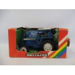 A boxed Britains no. 9523 Ford Tractor, box condition poor.