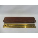 A mahogany cased brass level, engraved 'Army & Navy C.L.L.'.
