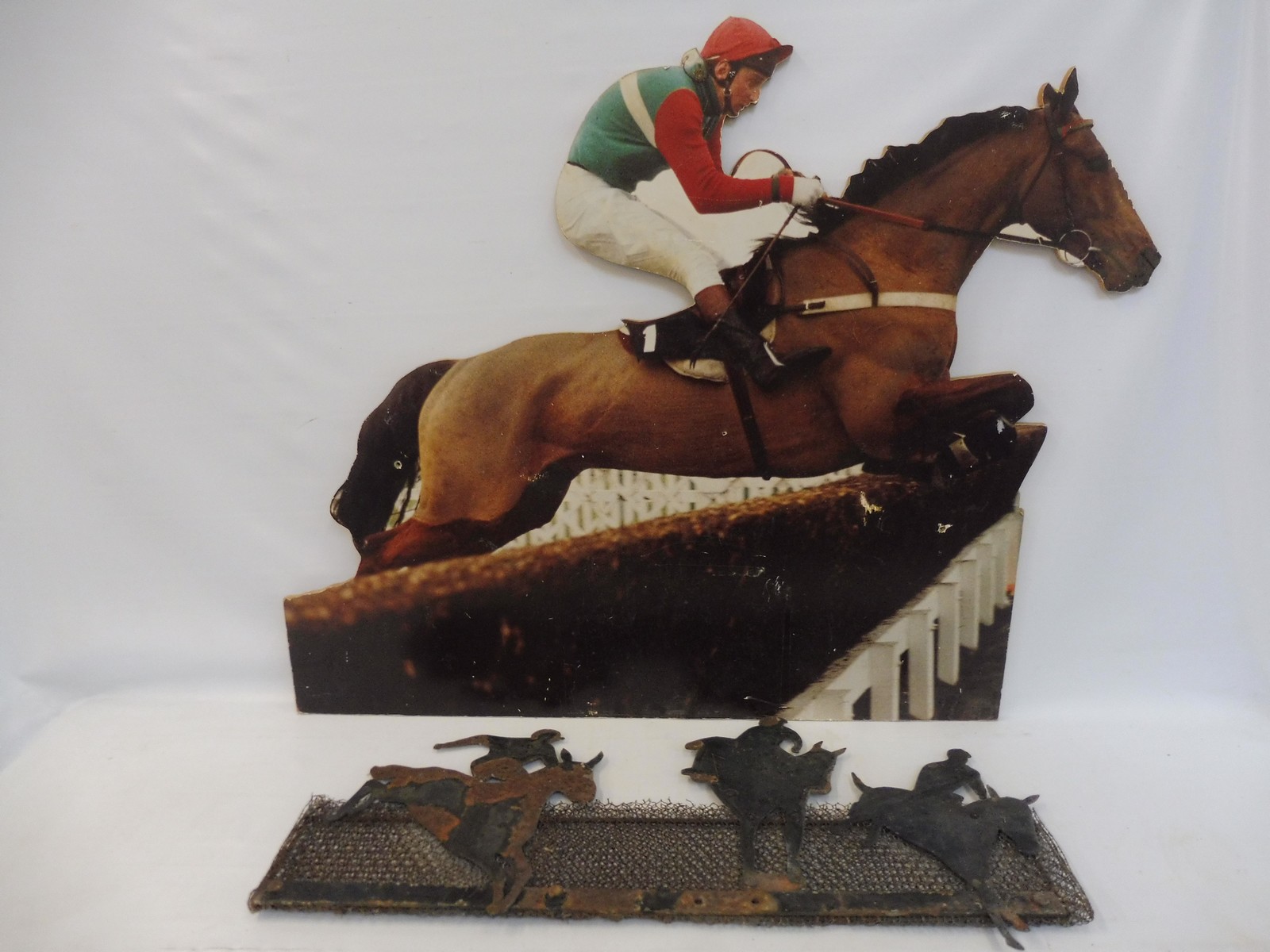 A folk art wirework fire guard with three horses and jockeys racing, plus a wooden horse racing