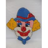 A large scale circa 1970s clown hoopla game with a cheat mechanism to the rear.
