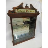A counter top front opening dispensing cabinet with glass advertising pedimant for Choice