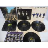 Four original Beatles albums including Abbey Road, all in VG+ condition.