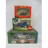 Three boxed die-cast - a Land Rover Series I, a Siku Ford Spalding and an Austin Healey.