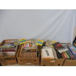 Four boxes of railway related books, manuals, jigsaws etc.