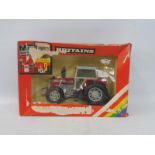 A boxed Britains no. 9520 Massey Ferguson Tractor, box condition poor, model condition very good.