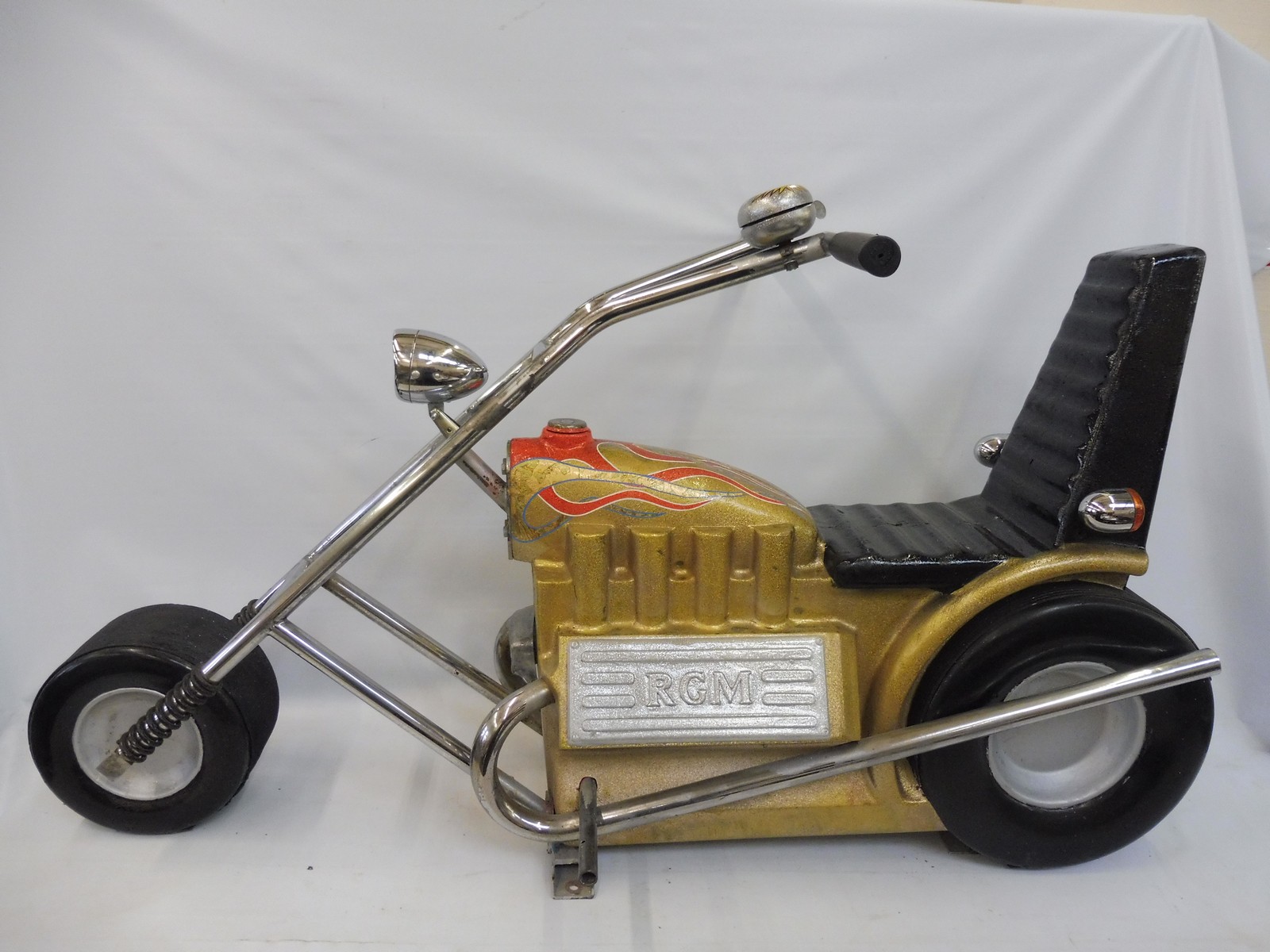 A large scale fairground juvenile low rider motorcycle, fantastic paintwork, circa 1970s.