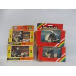 Four boxed Britains motorcycles including a Norton 850 police bike.