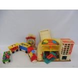 A box of vintage Fisher Price toys to include a garage and accessories.
