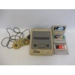 A Nintento Super Nintendo game console with games (unchecked).