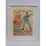 A framed reproduction Elvis Presley poster, 17 x 21".