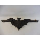 An unusual folk art lead filled pediment in the form of a bat with outstretched wings, probably 19th