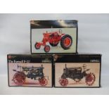 Three Precision Series model tractors: The Farmall F-20 (x2) and a Farmall Regulator.