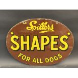 A Spillers oval double sided enamel sign in very good condition, to one side advertising 'Shapes'