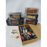 A quantity of boxed die-cast, various makers, various scales across three boxes.