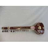 An original Sitar in case.