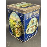 A Liptons Tea square dispensing tin, with bright pictorial designs to the exterior.