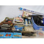 Four boxes of HO/OO scale track, railway and accessories, mainly Peco.