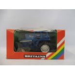 A boxed Britains, no. 9524 Ford tractor, box condition average, model appears excellent.