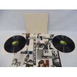 An original Beatles White Album, side loader, Beatles raised to front cover, vinyl appearing at