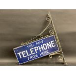 A 'You May Telephone From Here' rectangular enamel sign on original hanging bracket, 23 x 28". (