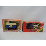 Two boxed Britains: 9499 Tumbrel Cart and 9565 Tipper.