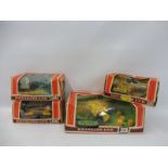 Four boxed Britains Farm Implements and Accessories - no. 9535, 9533, 9548 and a 9563 Hay Baler.