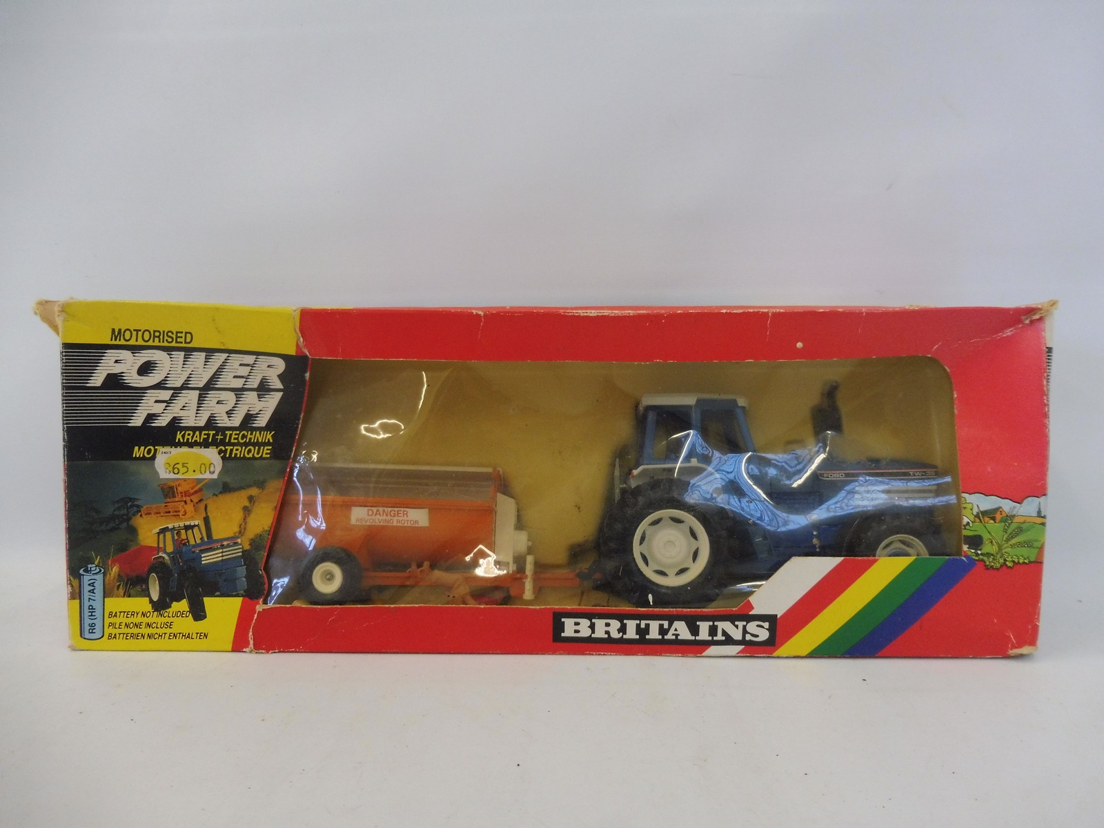 A boxed Britains Power Farm Motorised Tractor and Implement no. 9382, box condition average, model