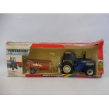 A boxed Britains Power Farm motorised Ford TW35 tractor and manure spreader in a Britains rainbow