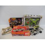 A selection of boxed model vehicles to include a racing car.