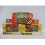 Three boxed Britains motorcycles.