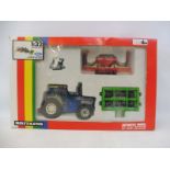 A boxed Britains: no. 9641 Ford TW25 tractor, coil packer and seeder, circa 1989 Rainbow pack, box