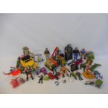 A tray of mainly 1980s action figures and accessories to include Jurassic Park and Teenage Mutant