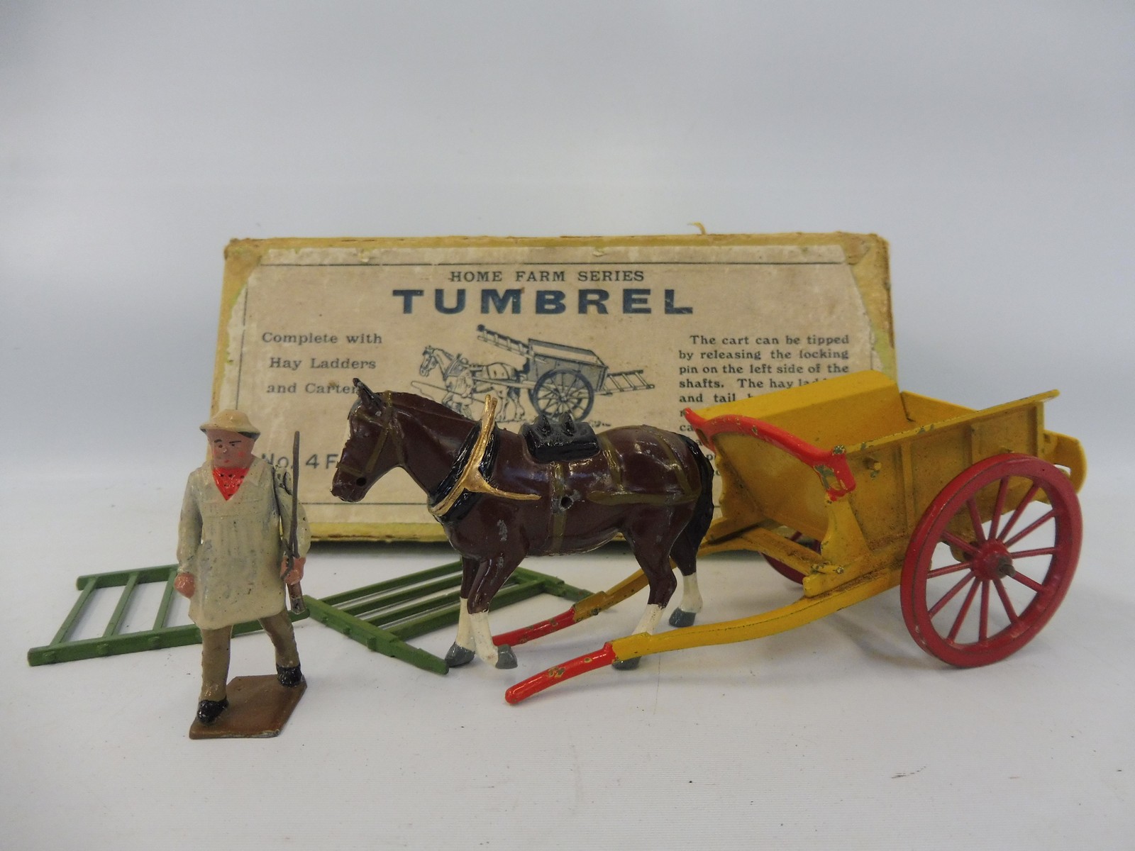 A Britains Home Farm Series no. 4F, in original box - lead cart, figure and horse.