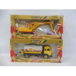 Two boxed Britains - no. 9911 and 9913, a Shell Petrol Tanker and a JCB Excavator.