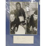 An original Pete Best of The Beatles signature mounted alongside a contemporary photograph.